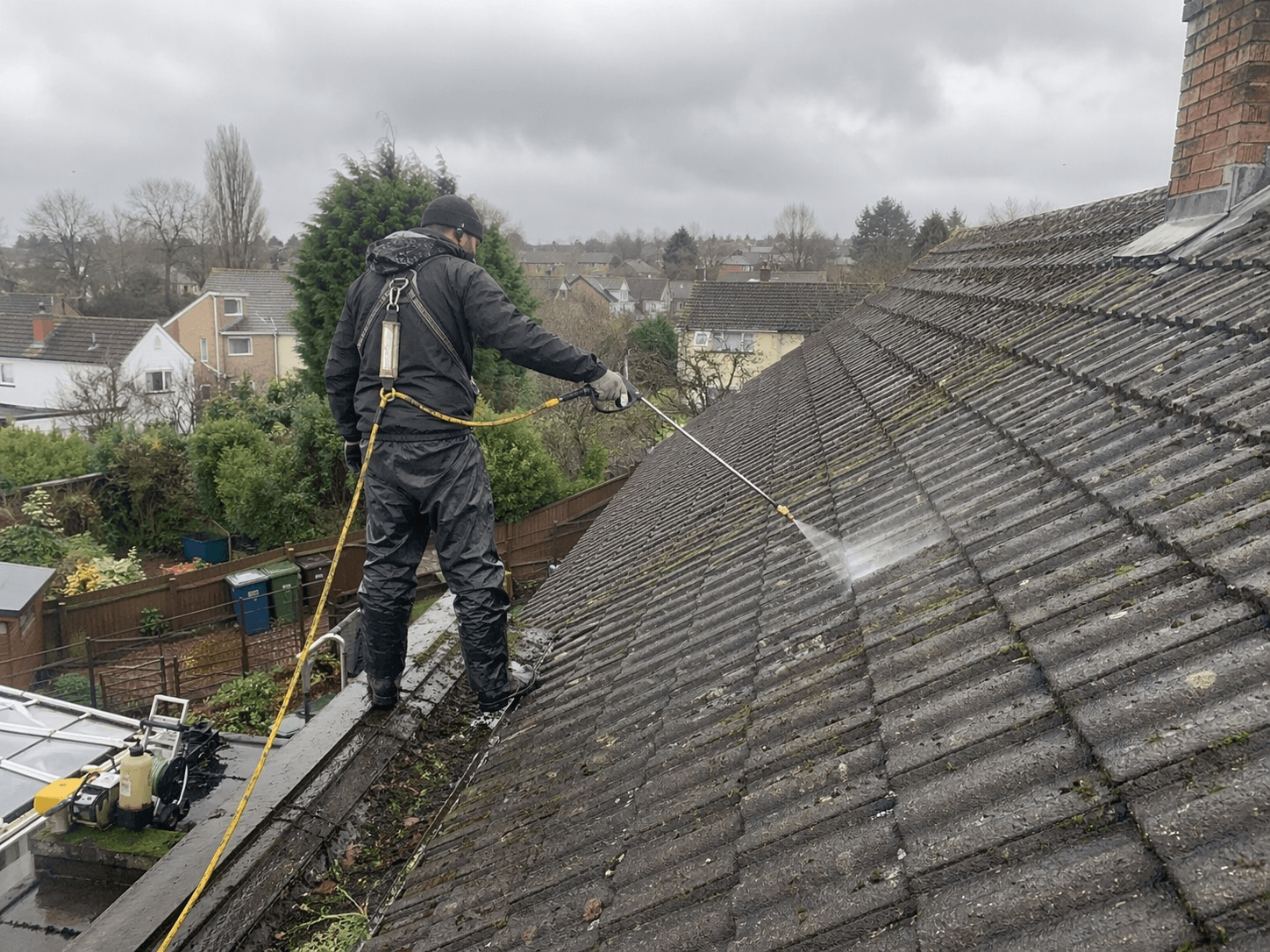 Roof cleaning specialist at work